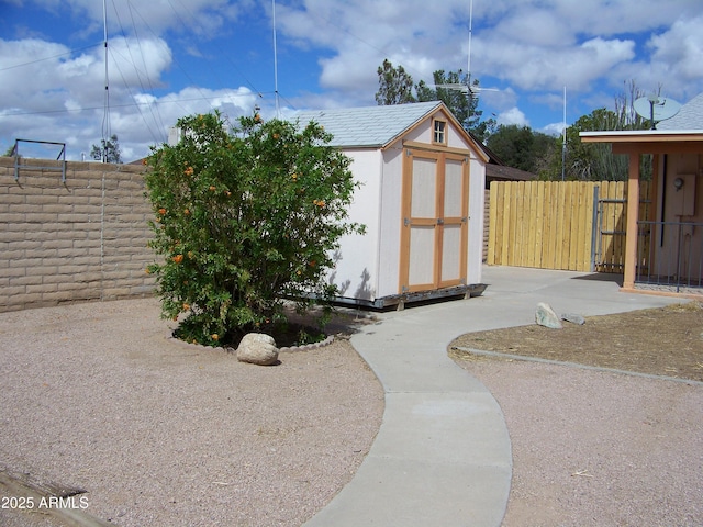 view of shed with fence