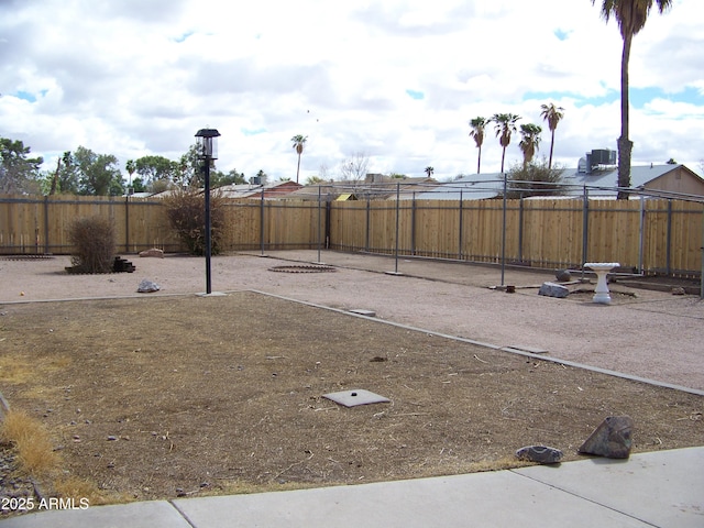 view of yard featuring cooling unit and fence private yard