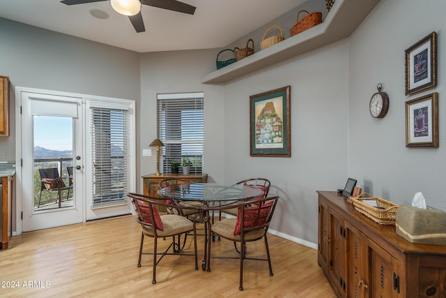 dining area featuring ceiling fan and light wood-type flooring