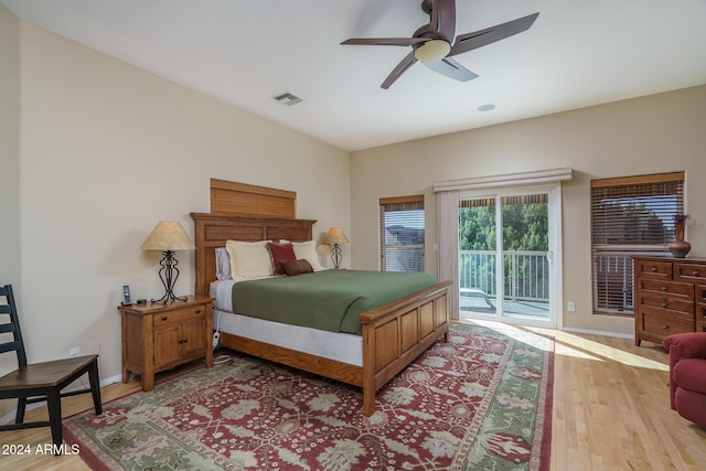 bedroom with access to outside, ceiling fan, and light hardwood / wood-style flooring