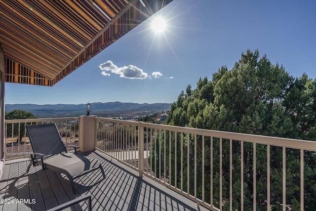 wooden terrace featuring a mountain view