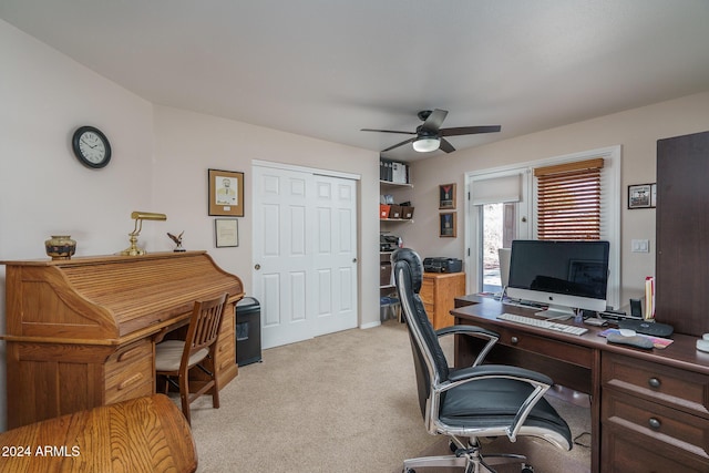 carpeted office with ceiling fan