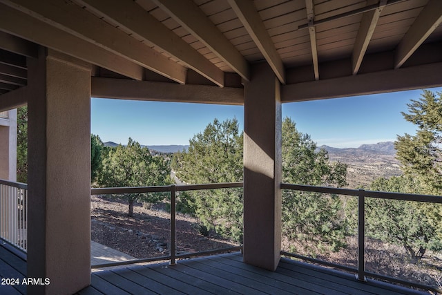 wooden deck featuring a mountain view