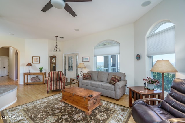 living room with ceiling fan and light hardwood / wood-style floors