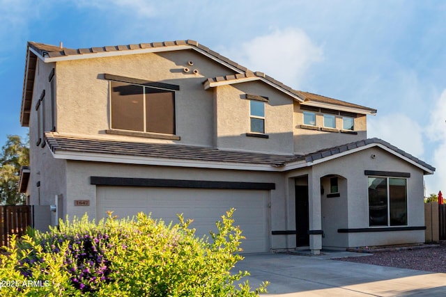 1647 W Gold Mine Way, San Tan Valley, AZ 85144 - view of front facade featuring fence, a tile roof, a garage, and stucco siding