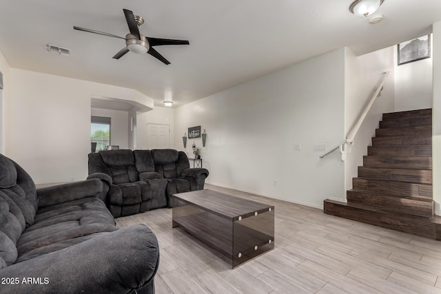 1647 W Gold Mine Way, San Tan Valley, AZ 85144 - living room featuring a ceiling fan, light wood-style floors, and stairs