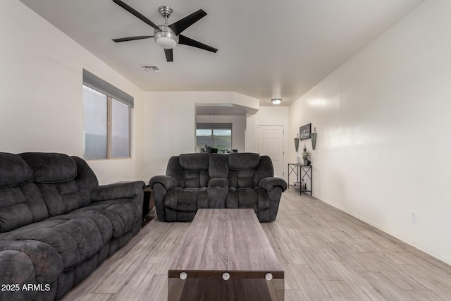 1647 W Gold Mine Way, San Tan Valley, AZ 85144 - living room with a ceiling fan, light wood-style floors, and baseboards