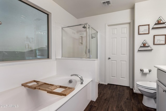 1647 W Gold Mine Way, San Tan Valley, AZ 85144 - full bath with a shower stall, vanity, a garden tub, wood finished floors, and toilet