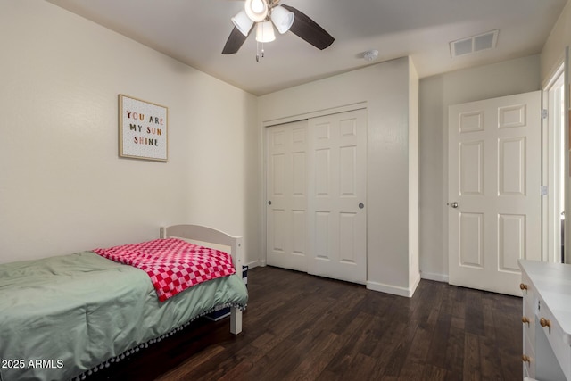 1647 W Gold Mine Way, San Tan Valley, AZ 85144 - bedroom featuring dark wood finished floors, a closet, baseboards, and a ceiling fan
