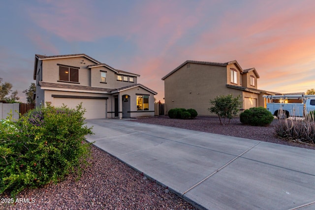 1647 W Gold Mine Way, San Tan Valley, AZ 85144 - view of front of property featuring a garage, driveway, stucco siding, and fence