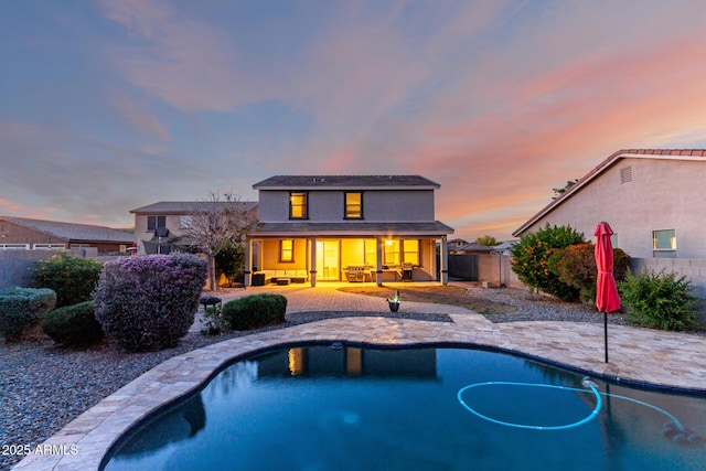 1647 W Gold Mine Way, San Tan Valley, AZ 85144 - rear view of house with fence, an outdoor living space, a patio, and a porch