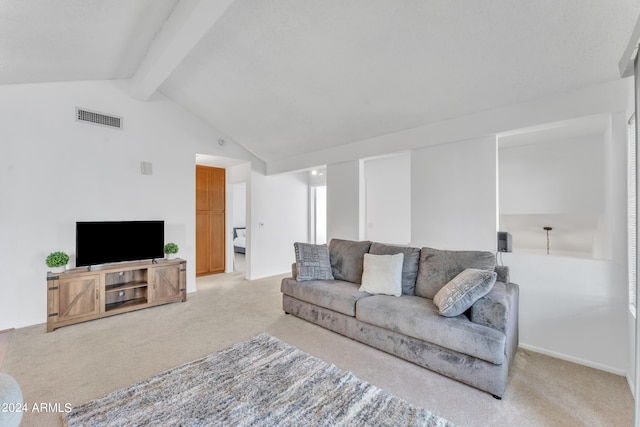 carpeted living room featuring vaulted ceiling with beams