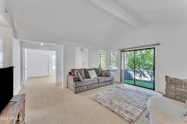 living room featuring light carpet and lofted ceiling with beams