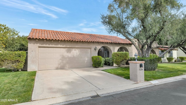 mediterranean / spanish home featuring a garage and a front lawn