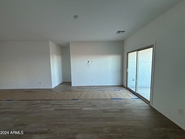 unfurnished room featuring dark hardwood / wood-style floors