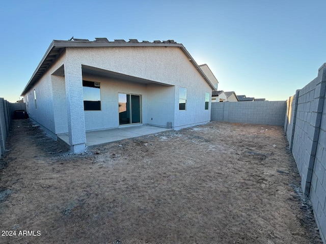 rear view of house featuring a patio area