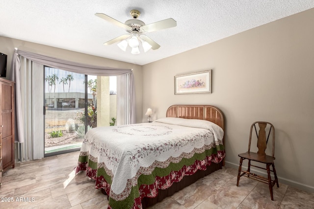 bedroom featuring a textured ceiling and ceiling fan