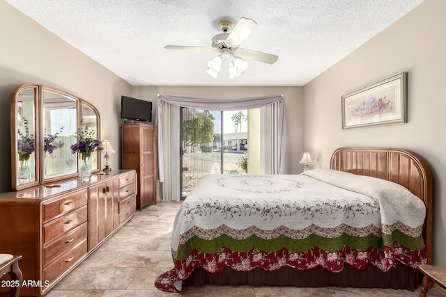 bedroom with ceiling fan, a textured ceiling, and access to outside