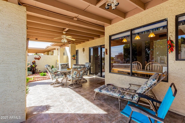 view of patio featuring ceiling fan