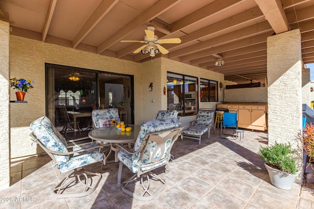 view of patio / terrace featuring ceiling fan