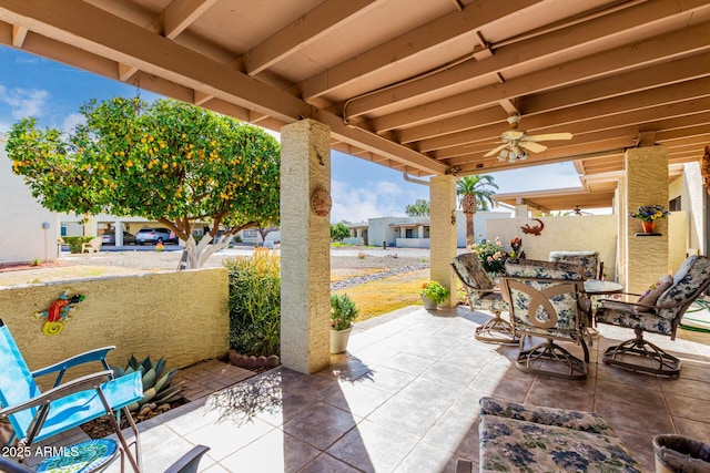 view of patio featuring ceiling fan