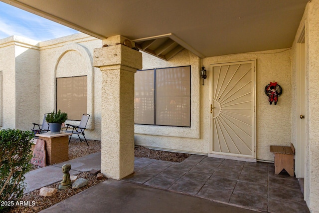 doorway to property with a patio