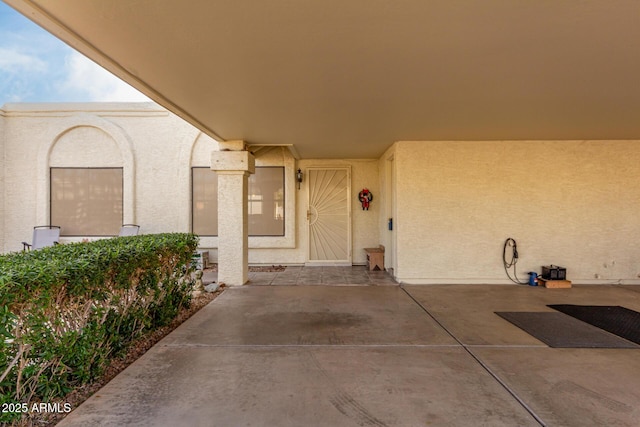 entrance to property with a patio