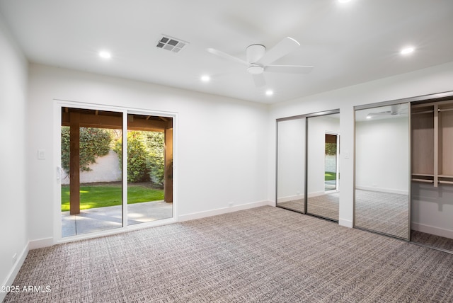 4525 N 66th St Unit 95, Scottsdale, AZ 85251 - unfurnished bedroom with multiple closets, carpet, recessed lighting, baseboards, and a ceiling fan