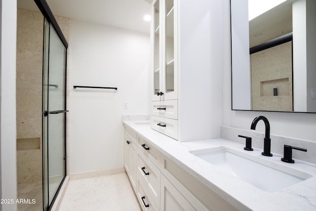 4525 N 66th St Unit 95, Scottsdale, AZ 85251 - full bathroom with a shower stall, double vanity, and baseboards