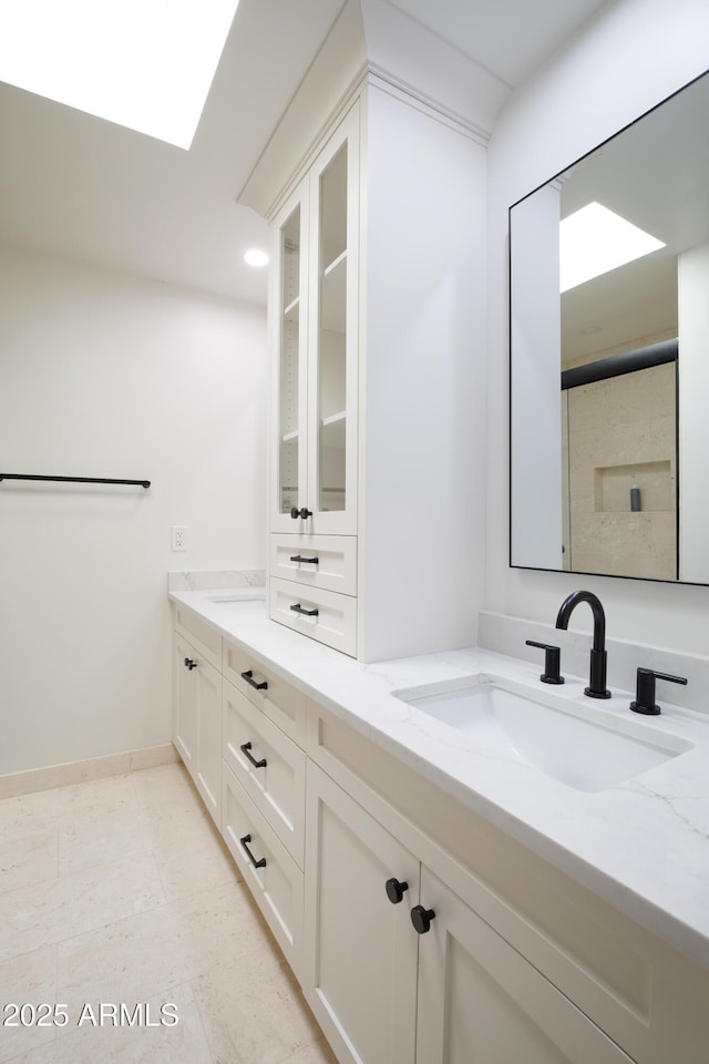 4525 N 66th St Unit 95, Scottsdale, AZ 85251 - bathroom featuring double vanity and baseboards
