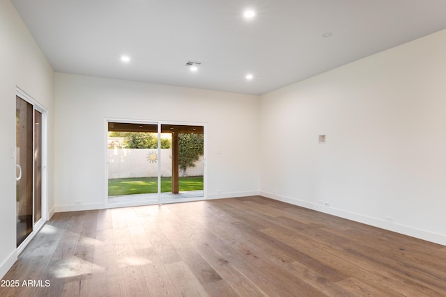 4525 N 66th St Unit 95, Scottsdale, AZ 85251 - unfurnished room featuring wood finished floors, baseboards, and recessed lighting