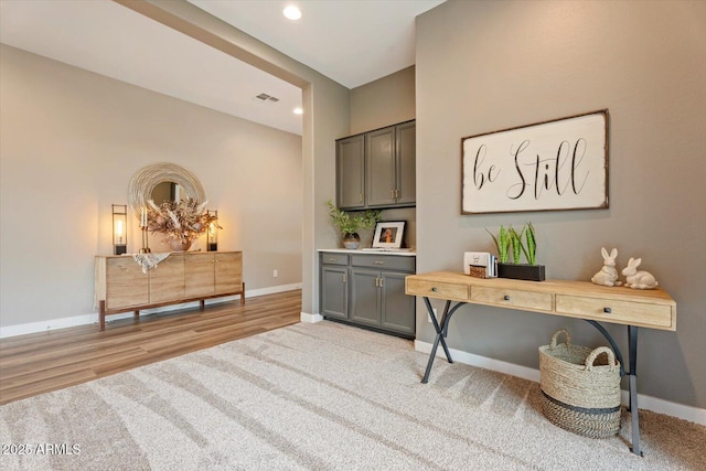 office area featuring recessed lighting, visible vents, light colored carpet, and baseboards