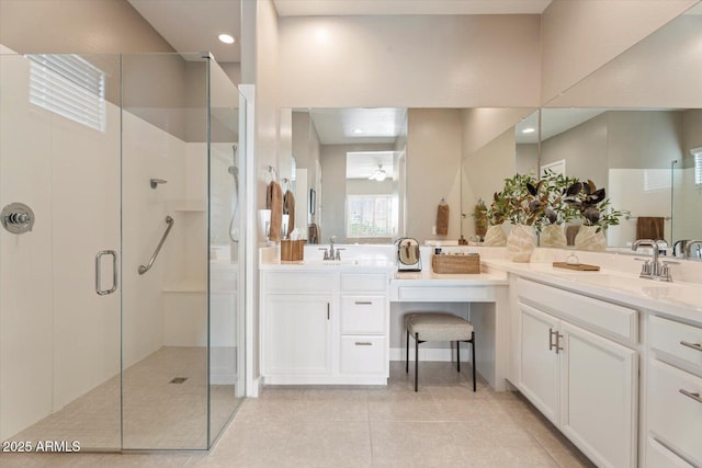 full bath featuring a shower with shower door, recessed lighting, vanity, and tile patterned flooring