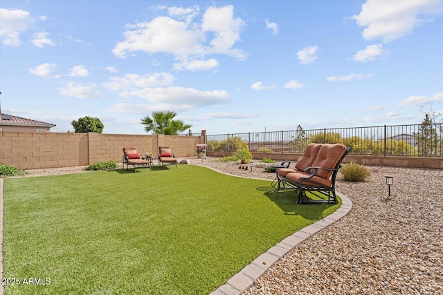 view of yard with a fenced backyard