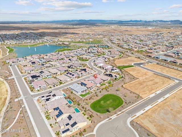 birds eye view of property featuring a residential view and a water and mountain view