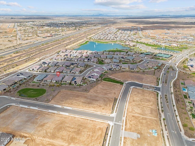 birds eye view of property featuring a residential view and a water view