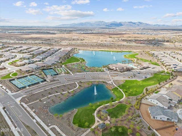 drone / aerial view with a residential view and a water and mountain view