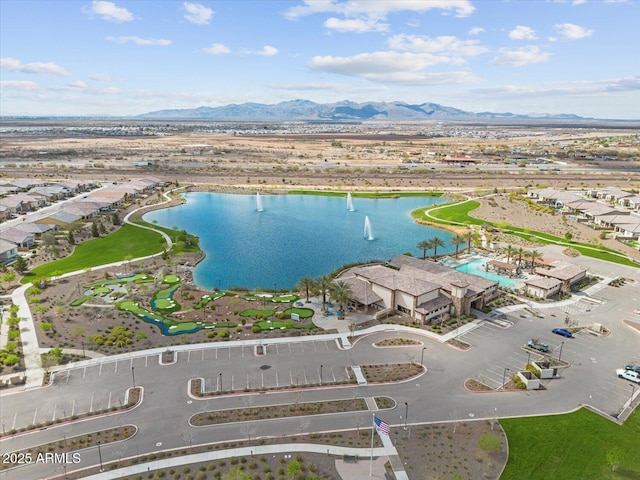 birds eye view of property featuring a water and mountain view