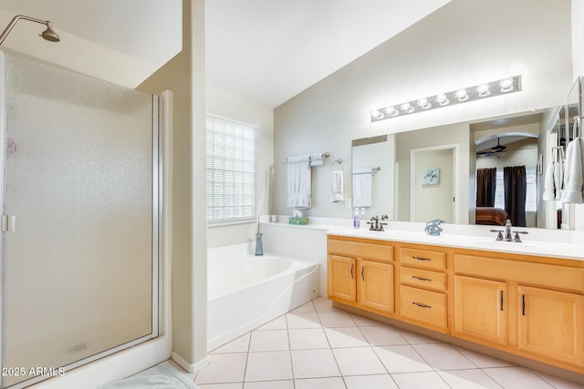 ensuite bathroom featuring double vanity, a stall shower, a sink, tile patterned flooring, and a bath