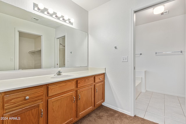 bathroom with tile patterned flooring and vanity