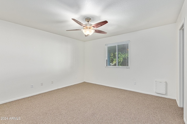 spare room featuring carpet floors and ceiling fan