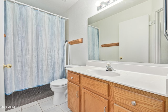 bathroom with tile patterned flooring, toilet, vanity, and curtained shower