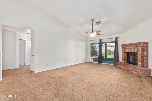 unfurnished living room with light carpet, a fireplace, high vaulted ceiling, and ceiling fan