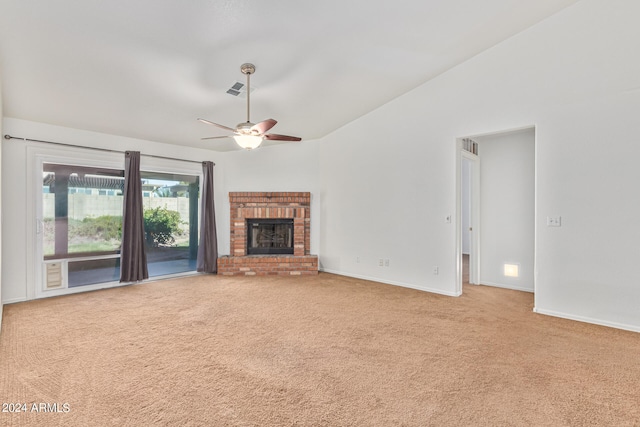 unfurnished living room featuring a fireplace, ceiling fan, and light carpet