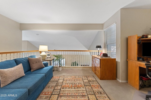 living area featuring lofted ceiling and light carpet