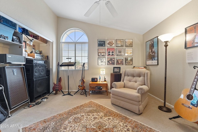 living area featuring carpet floors, baseboards, ceiling fan, and lofted ceiling