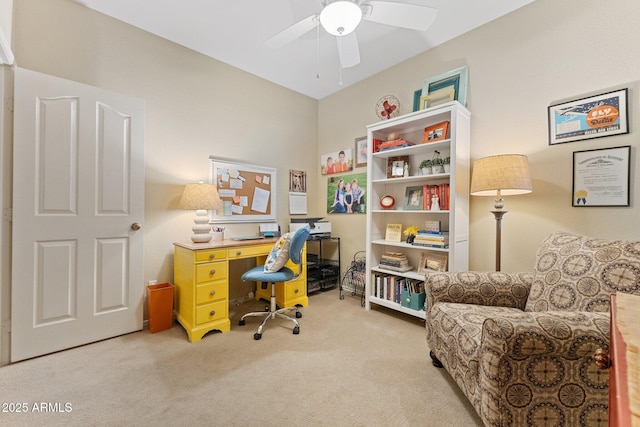 office space with a ceiling fan and light colored carpet