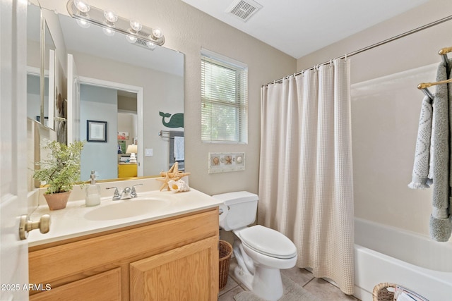 bathroom featuring toilet, visible vents, shower / tub combo with curtain, and vanity