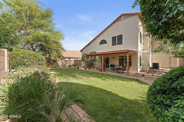 back of property with cooling unit, a fenced backyard, a yard, a patio, and stucco siding