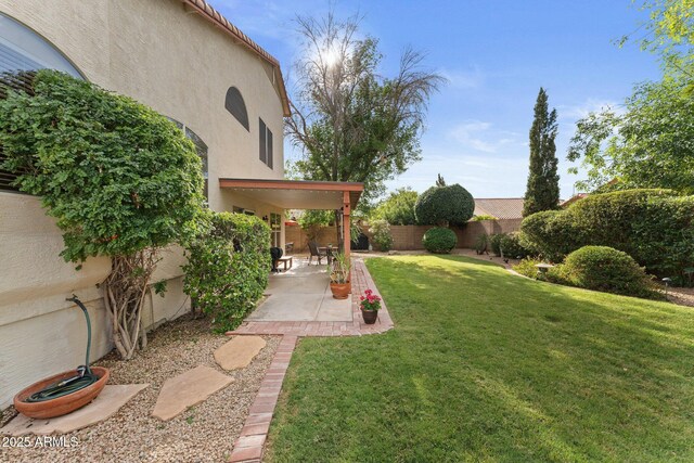 view of yard featuring a fenced backyard and a patio area